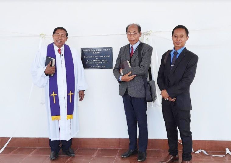 Rev Khrotso Mero with others after dedication of the new church building at K Basa on December 18.